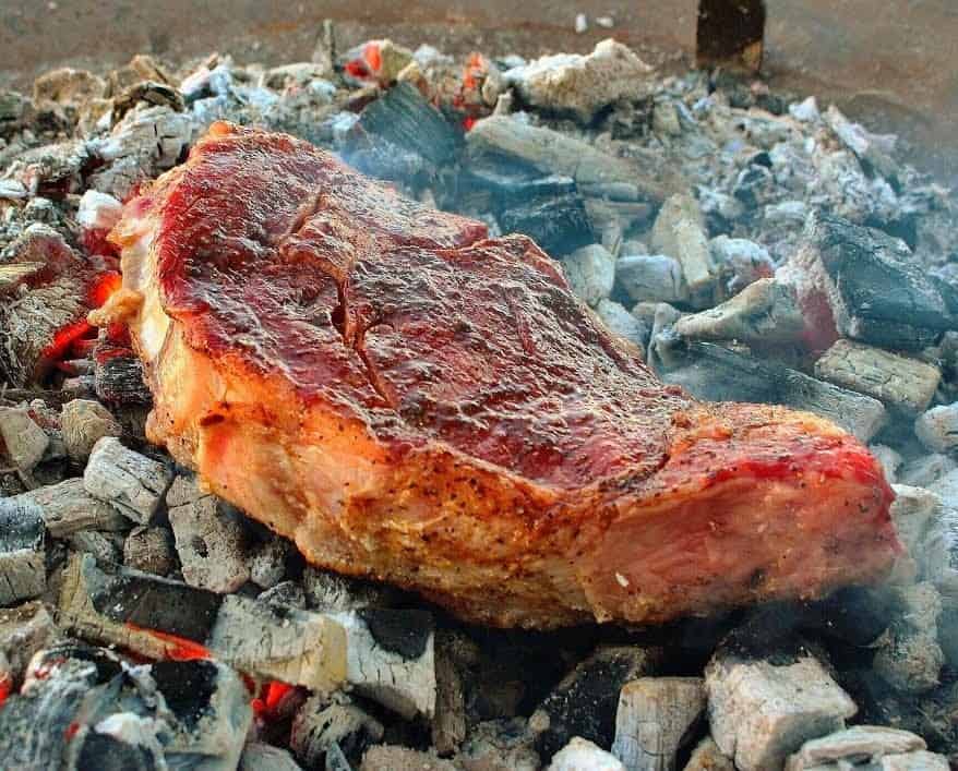 dirty steak on wood chunks