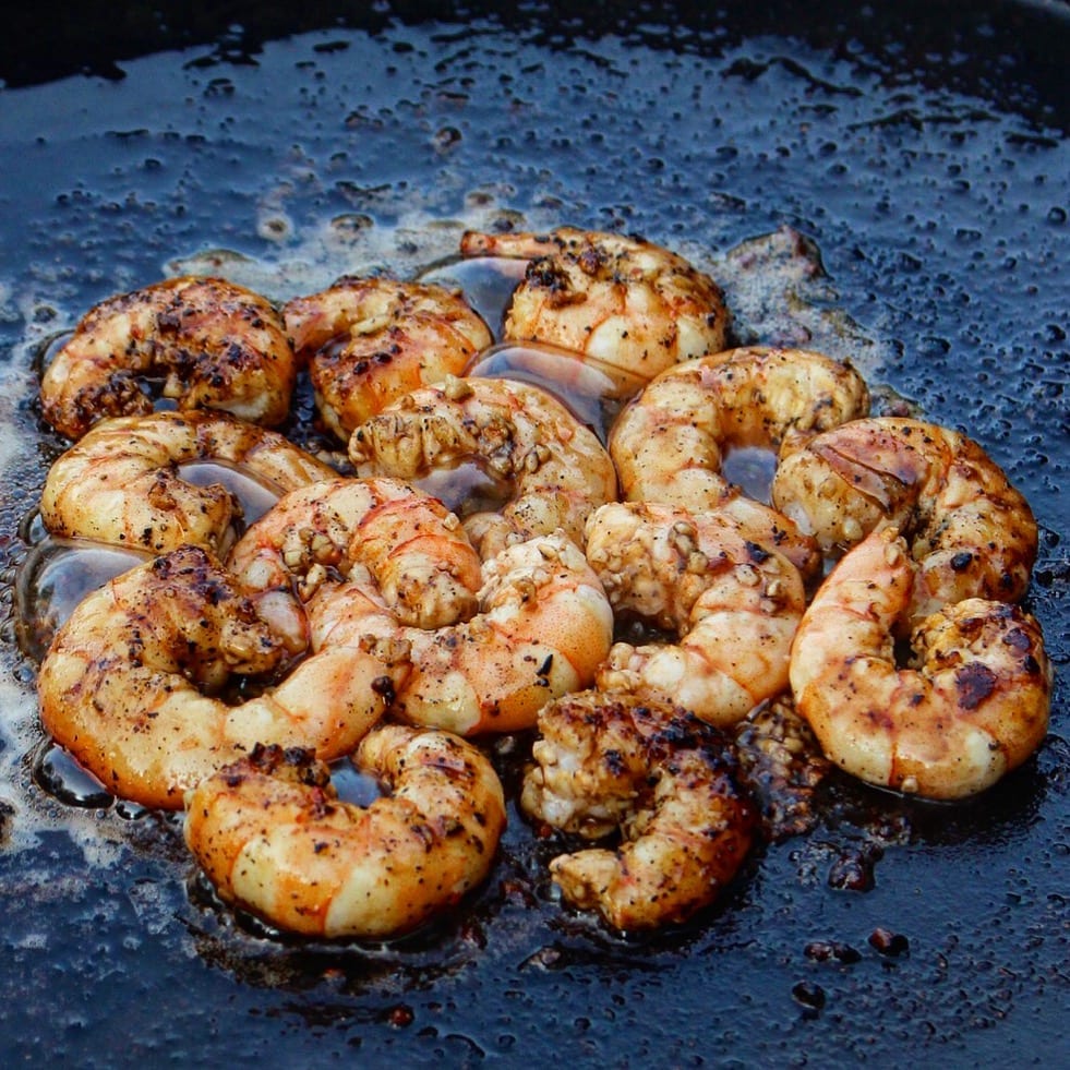 Make perfectly buttery grilled shrimp with this cast iron shrimp pan