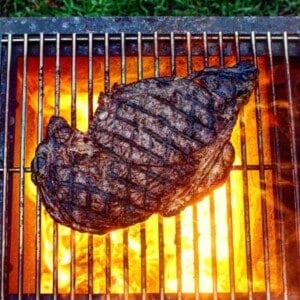 searing steak on the grill