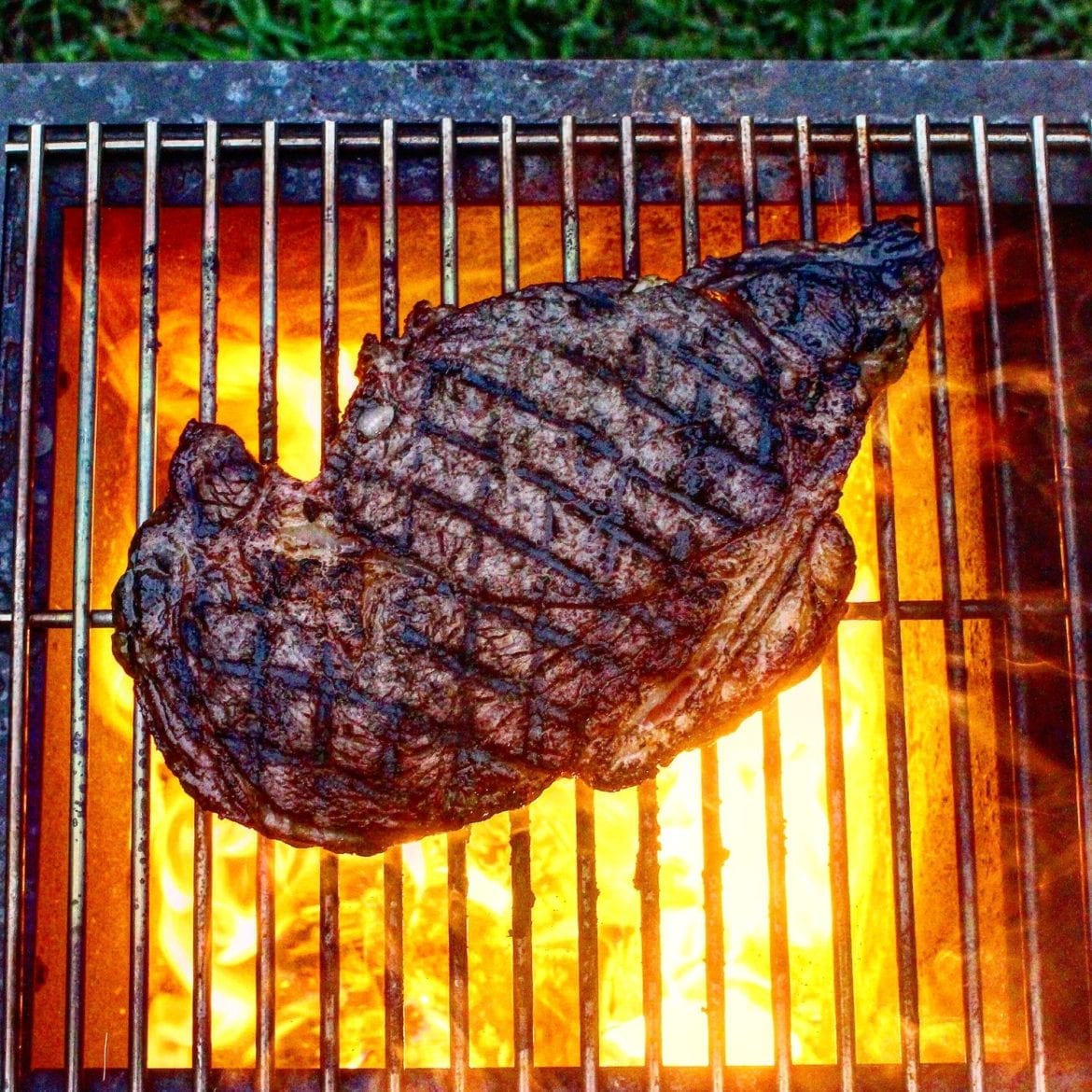 steak over the coals