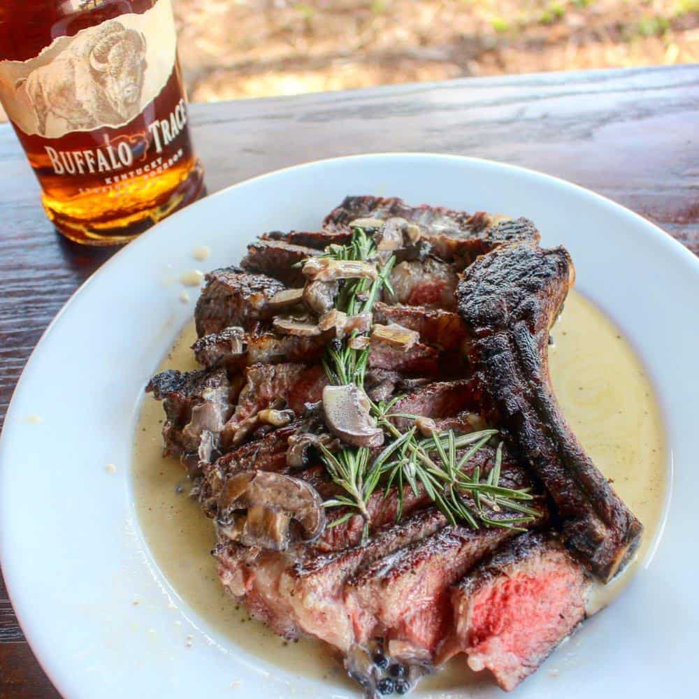 Ribeye with bourbon cream sauce on the plate