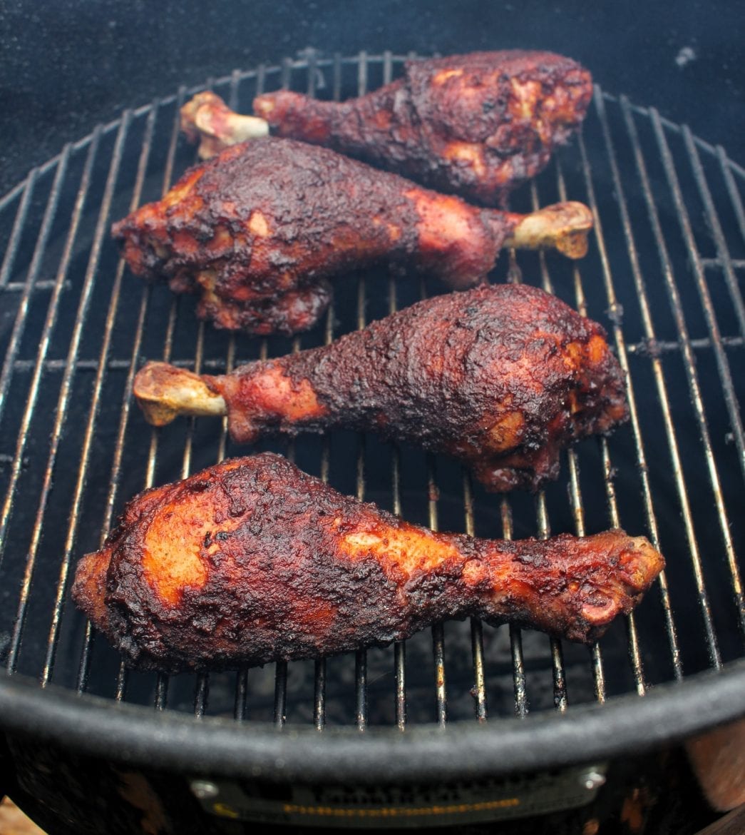 turkey legs cooking in the smoker