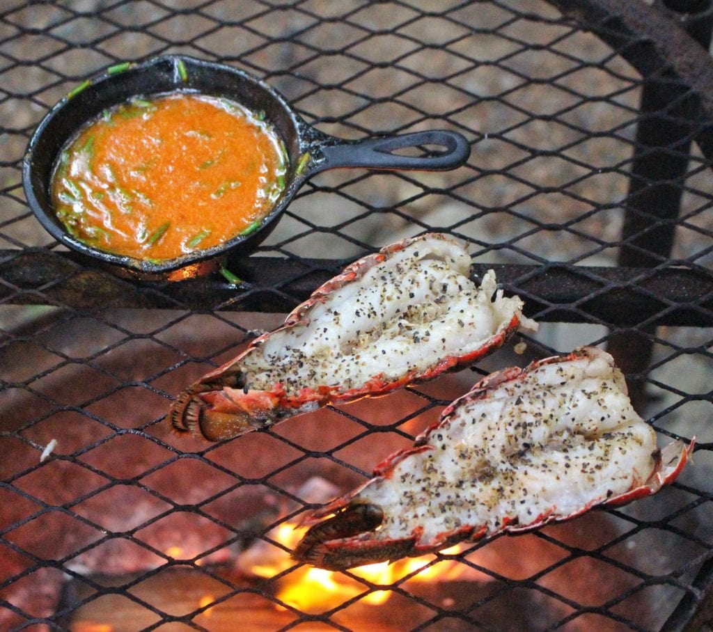 sriracha butter lobster tails over the fire