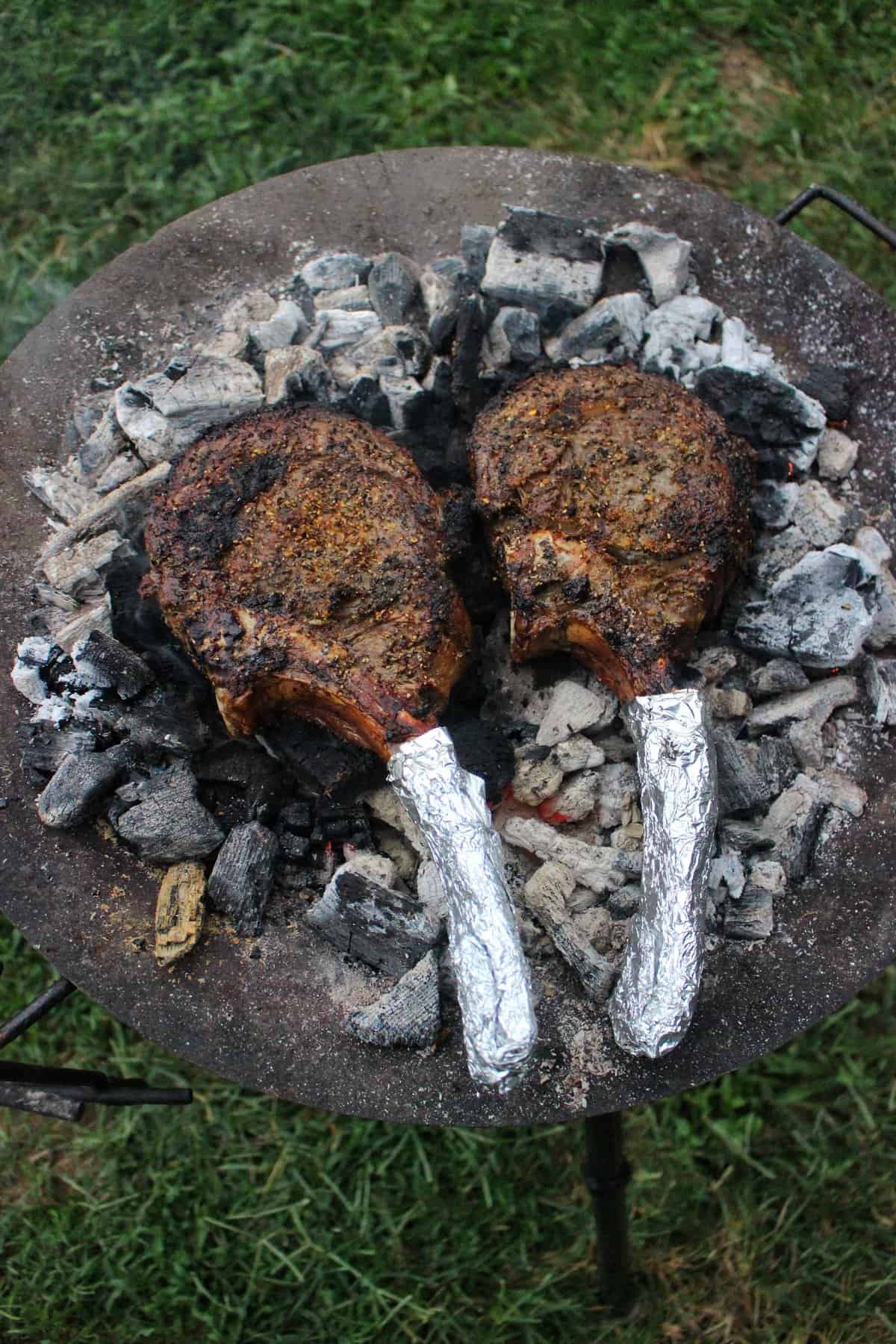 The tomahawk ribeye steaks after being flipped. 