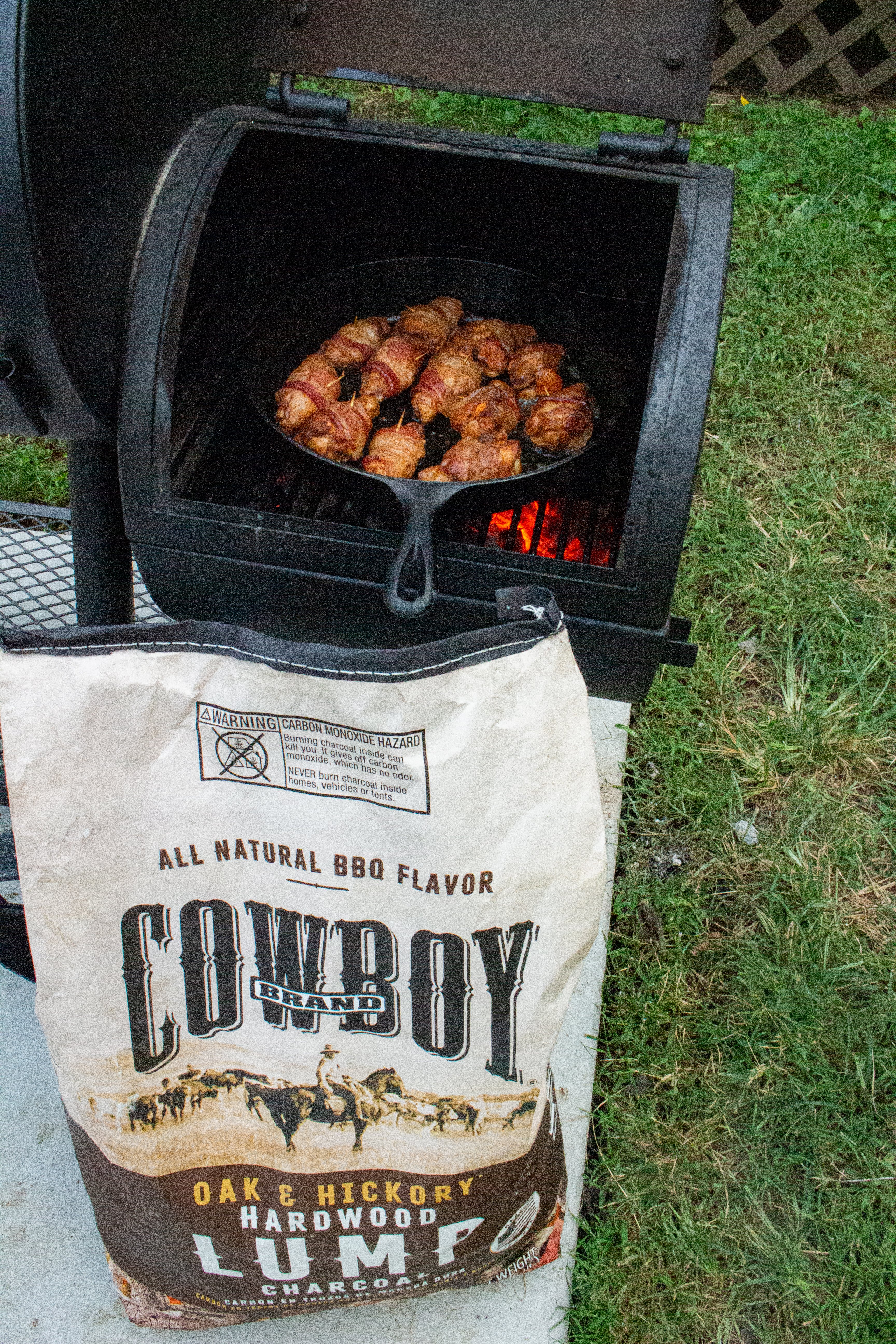 A shot of the Bacon Wrapped Chicken Wings with the cowboy charcoal. 