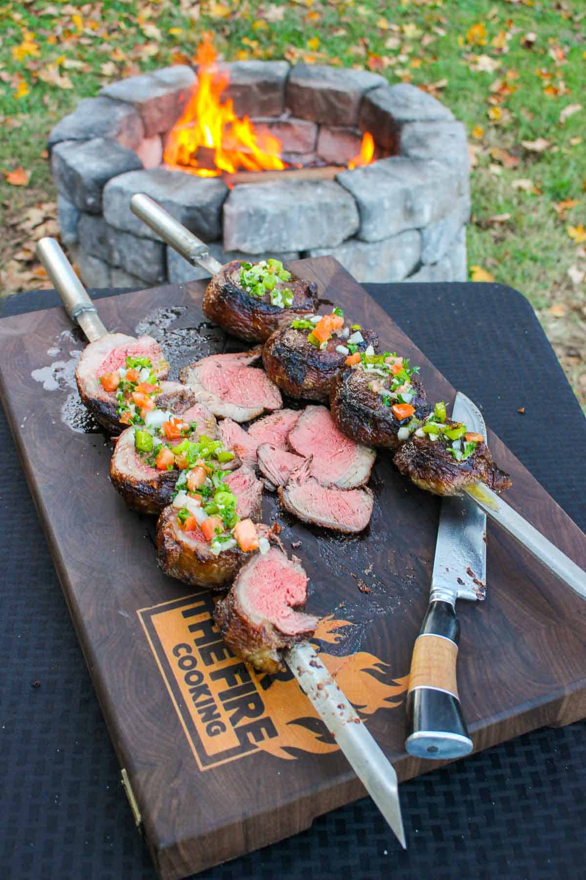 Skewered Picanha with Salsa Vinaigrette sliced and served.