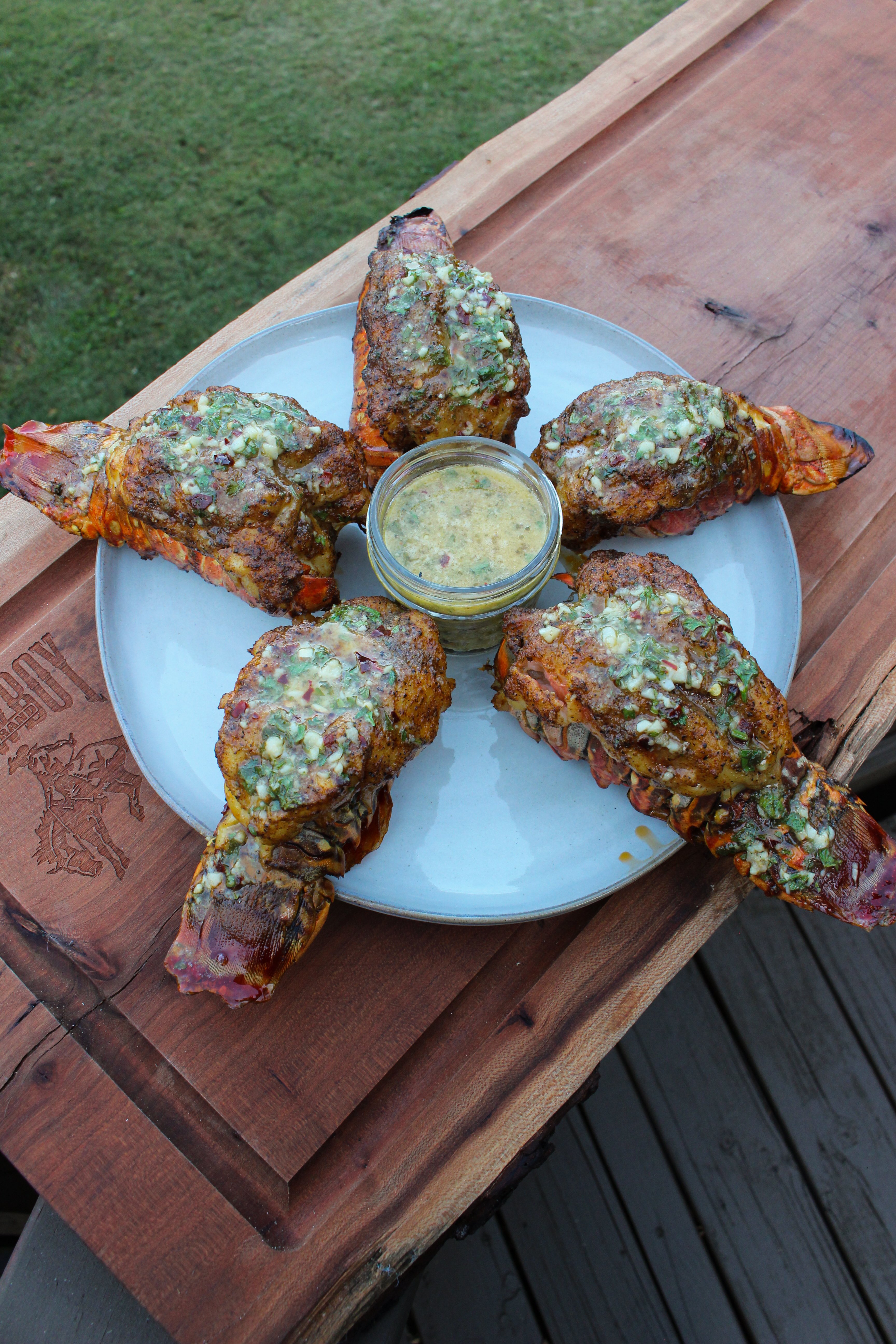 Smoked Lobster Tails with smothered in a garlic butter sauce. 