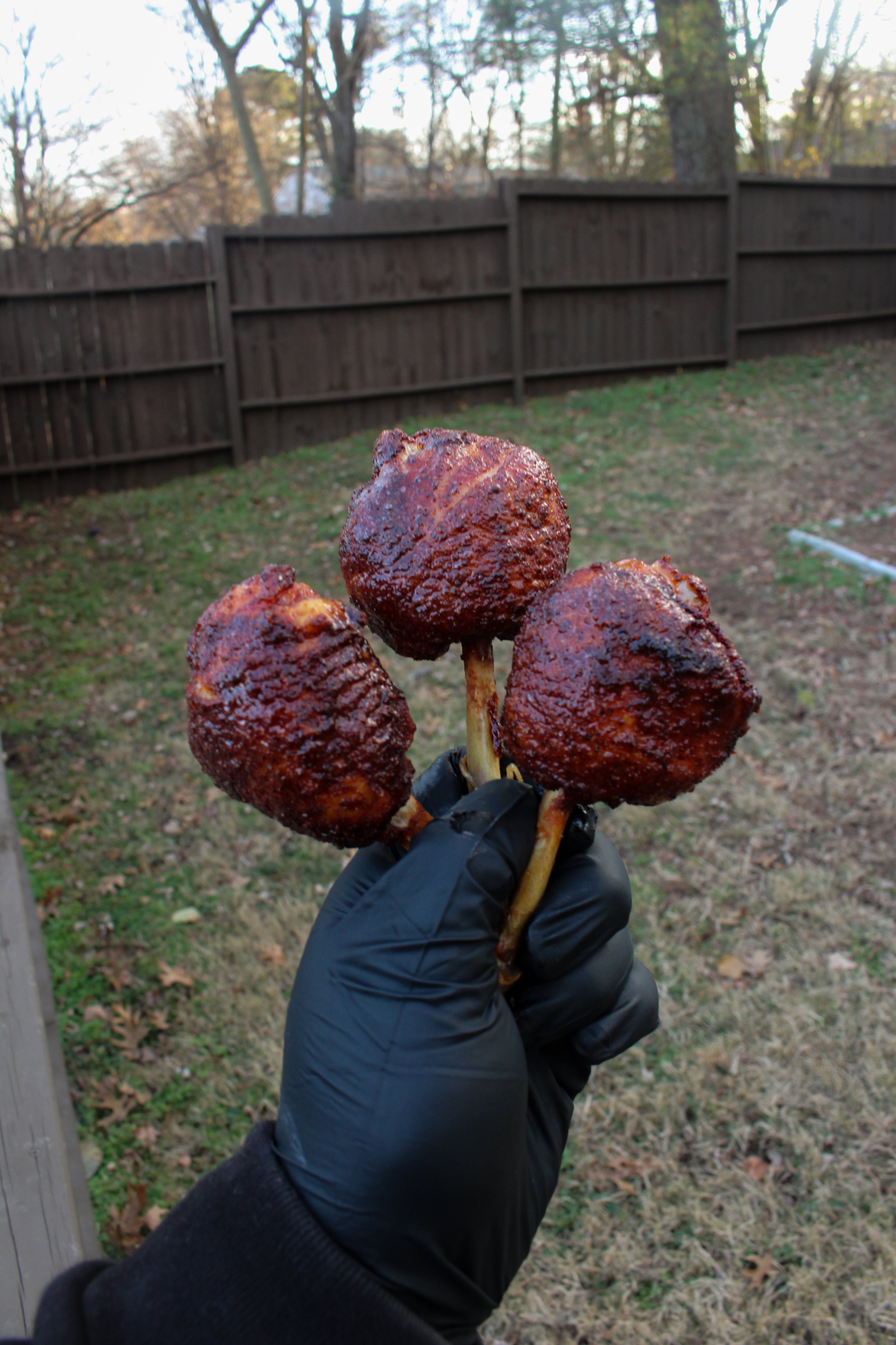 A close up of three Maple Hot Chicken Lollipops