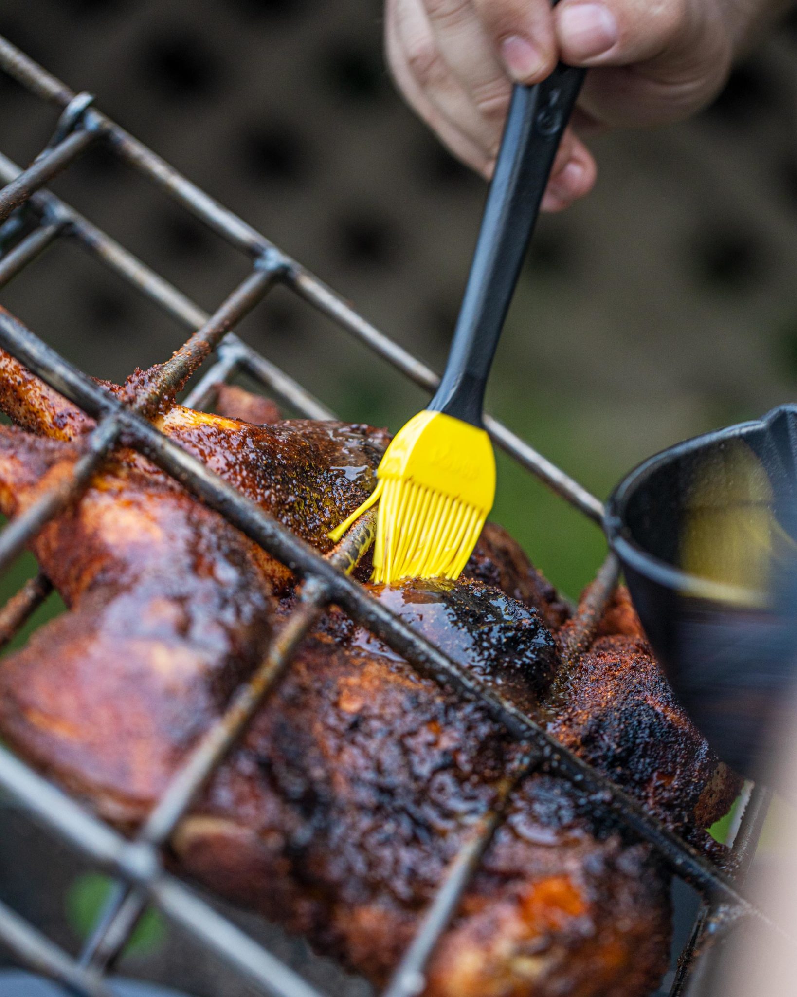 Hot Honey Chicken Asado getting brushed with the glaze.