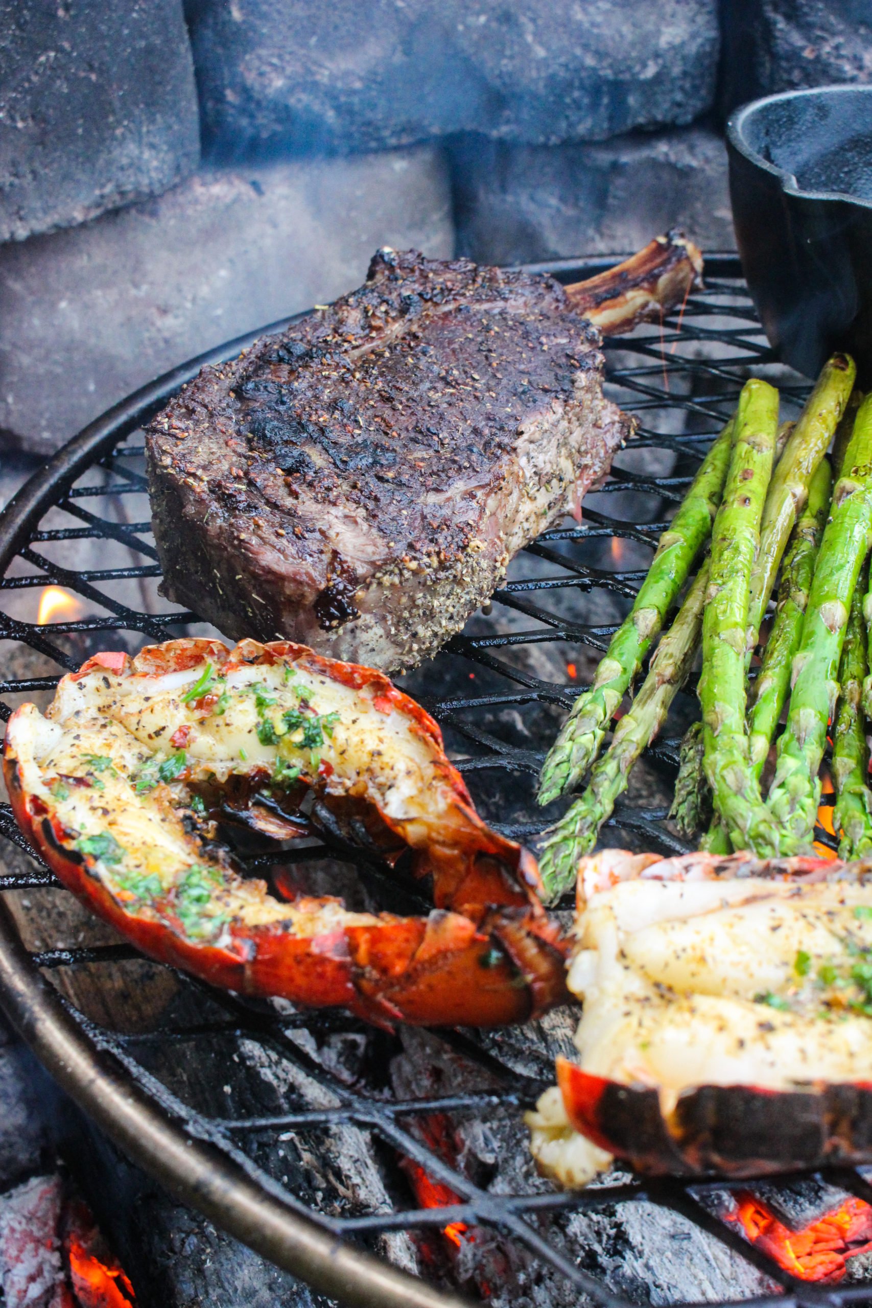 Bison Ribeye and Lobster Tails With Cheese