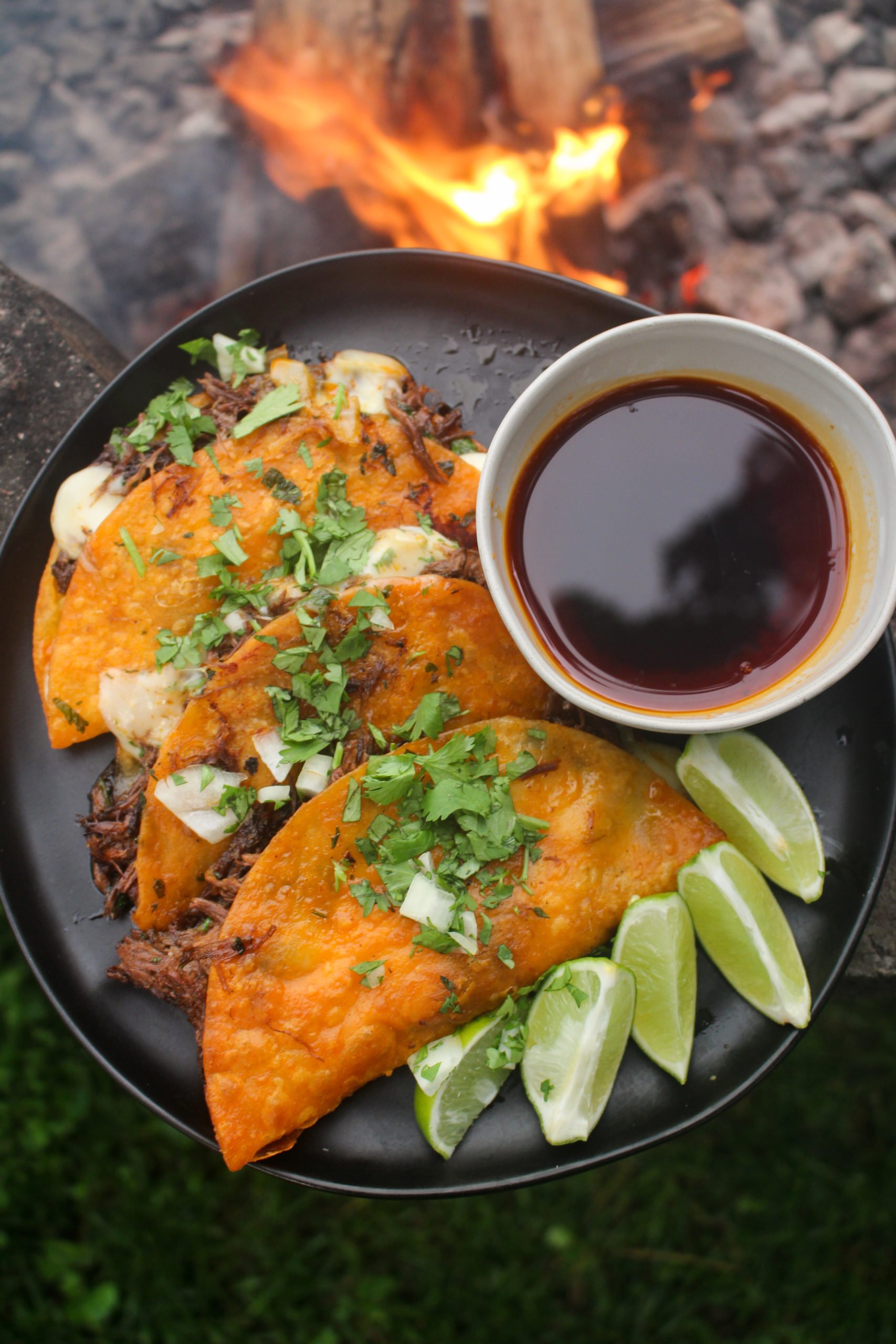 An overhead shot of the finalized Quesabirria Tacos.