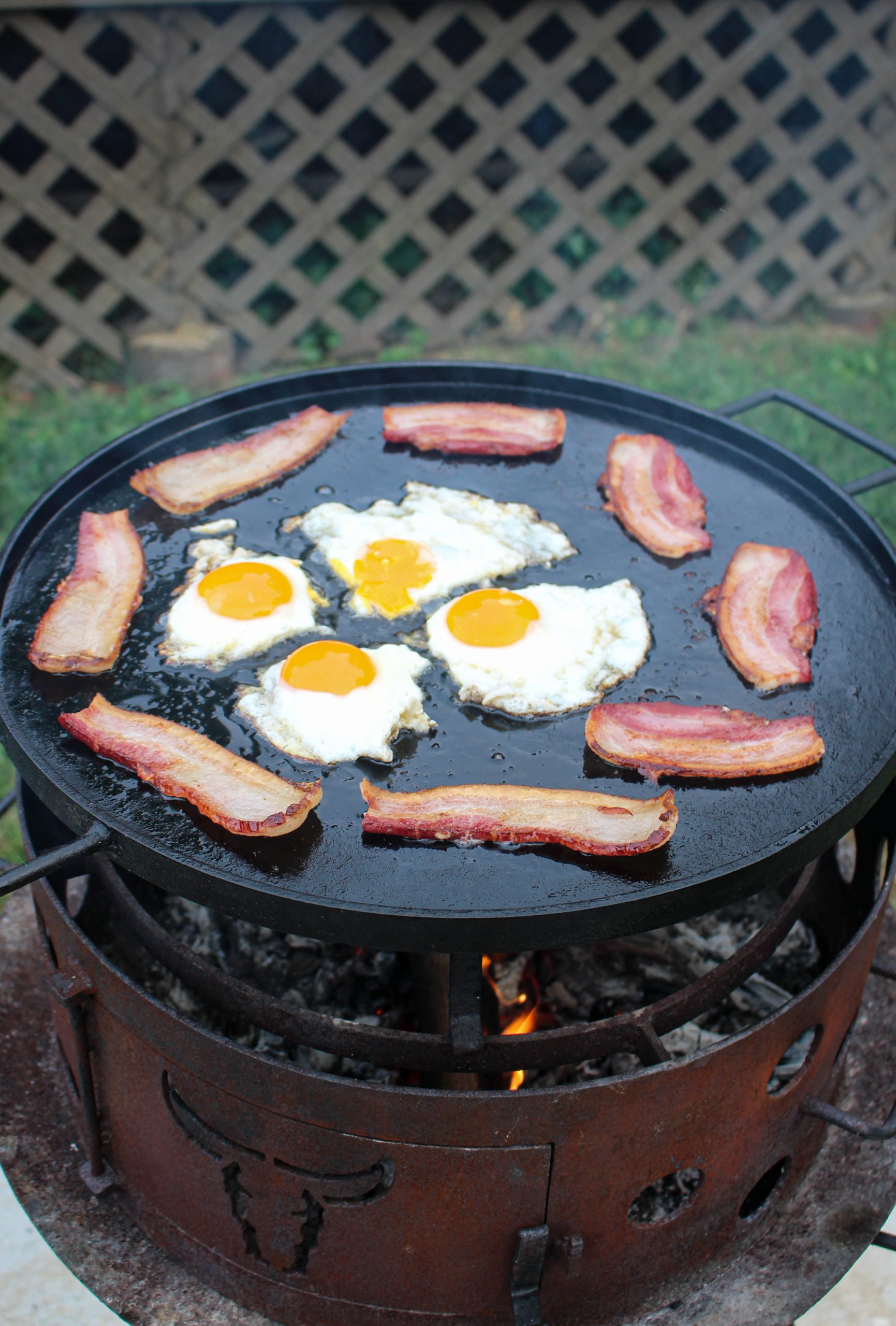 The frying bacon and eggs.