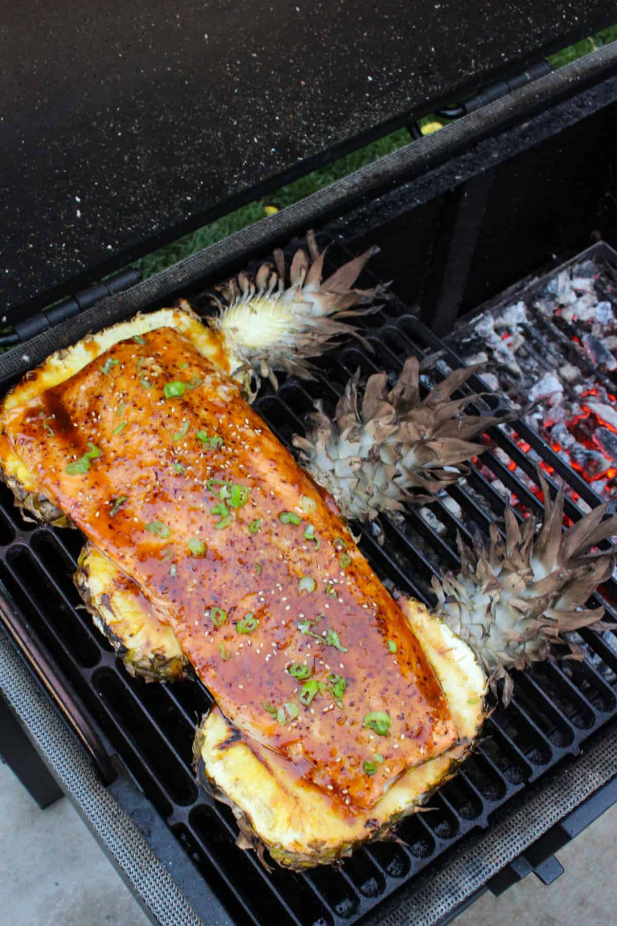 Sweet Pineapple Teriyaki Salmon finished cooking and ready to be removed from the grill. 