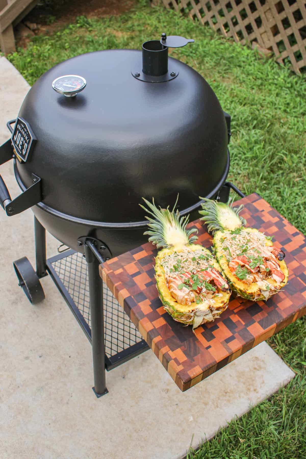 The dish sitting next to the new Oklahoma Joe grill. 