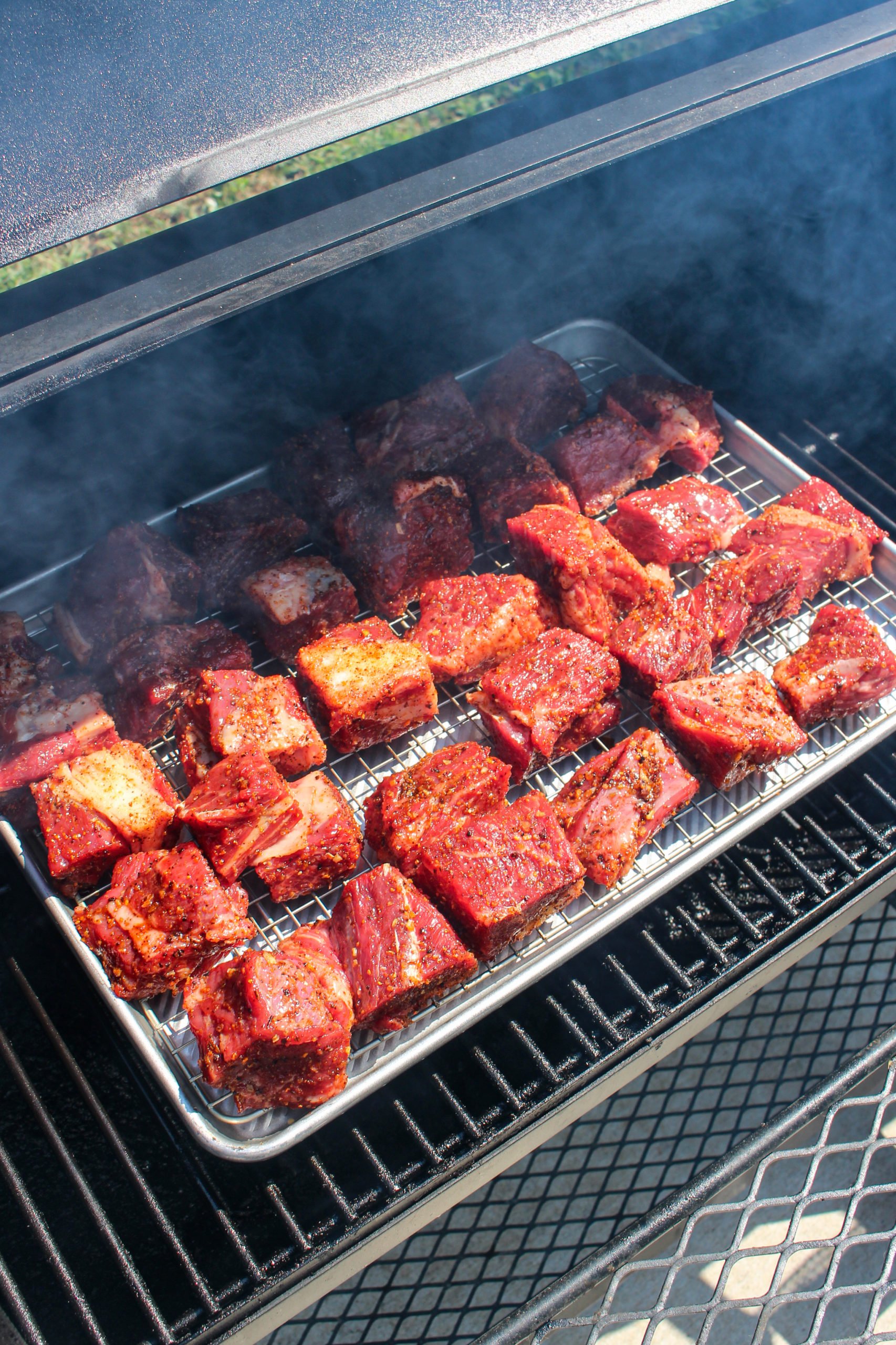 Poor Man's Burnt Ends placed on the smoker.