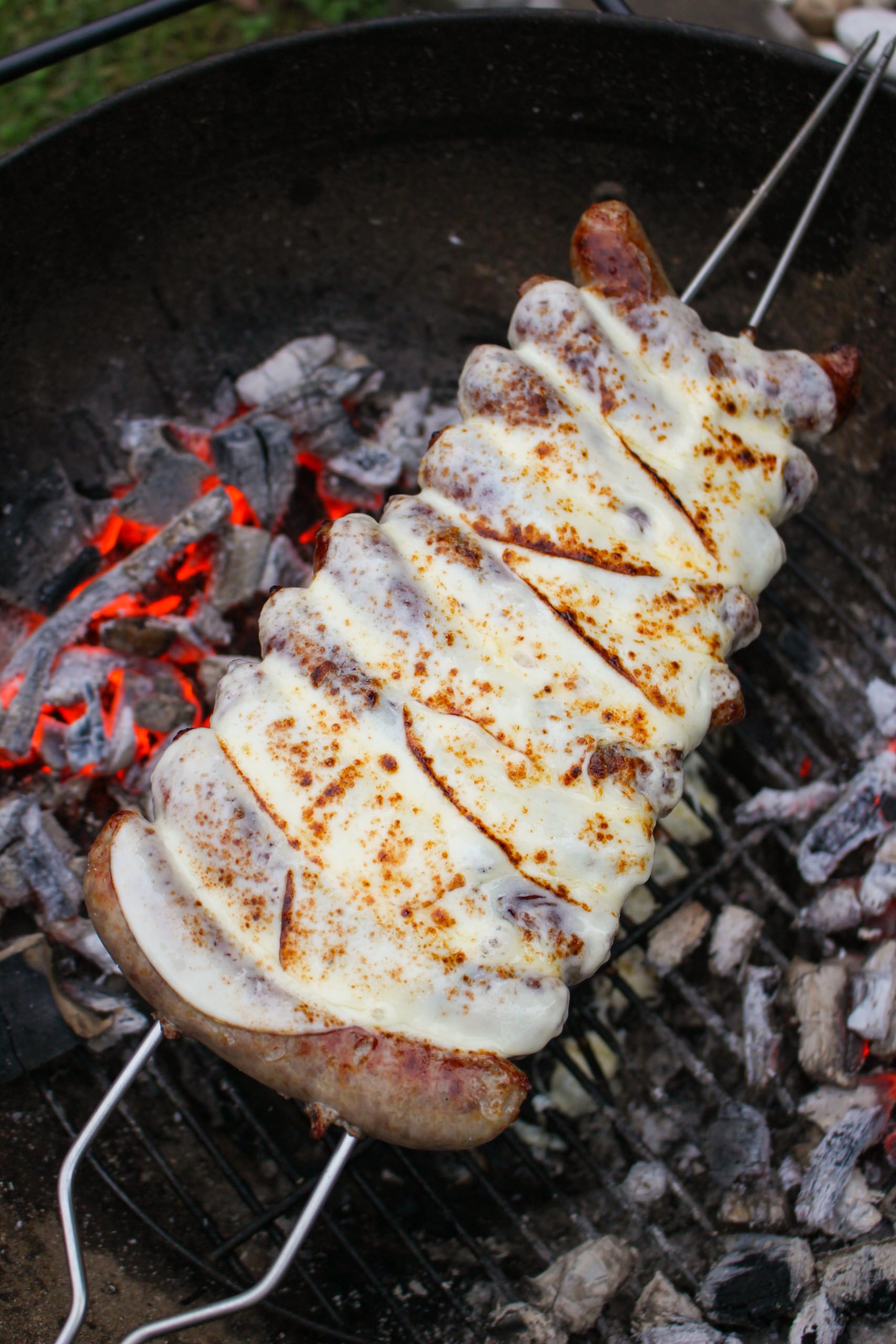 Philly Cheese Sausage Skewers with cheese added on top.