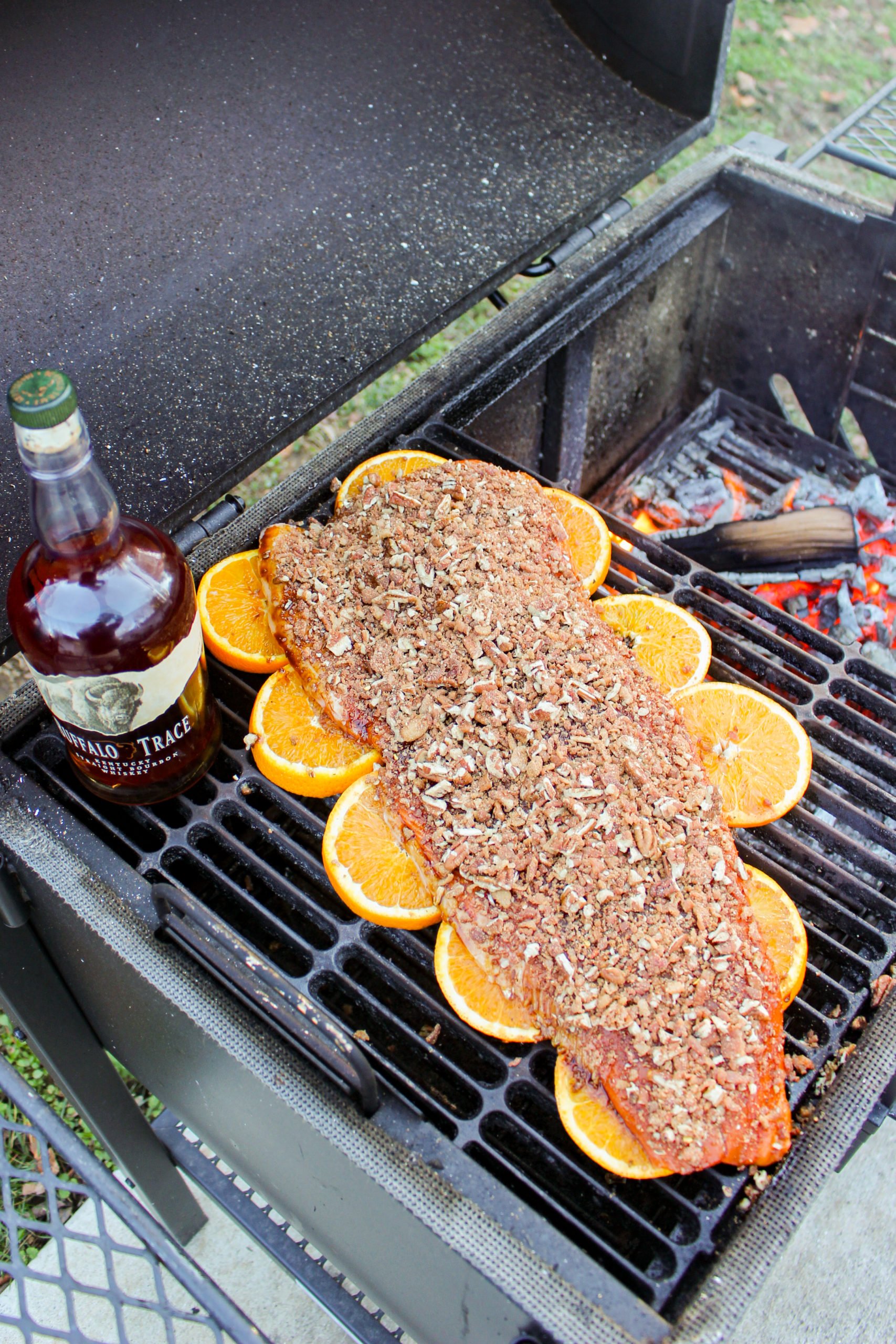 Bourbon Bacon Pecan Salmon getting prepped on the grill.