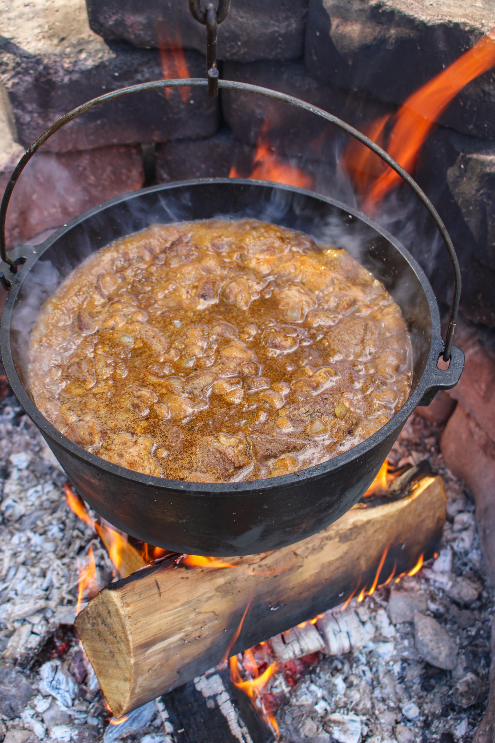 Chipotle Garlic Chili Con Carne boiling over the fire. 