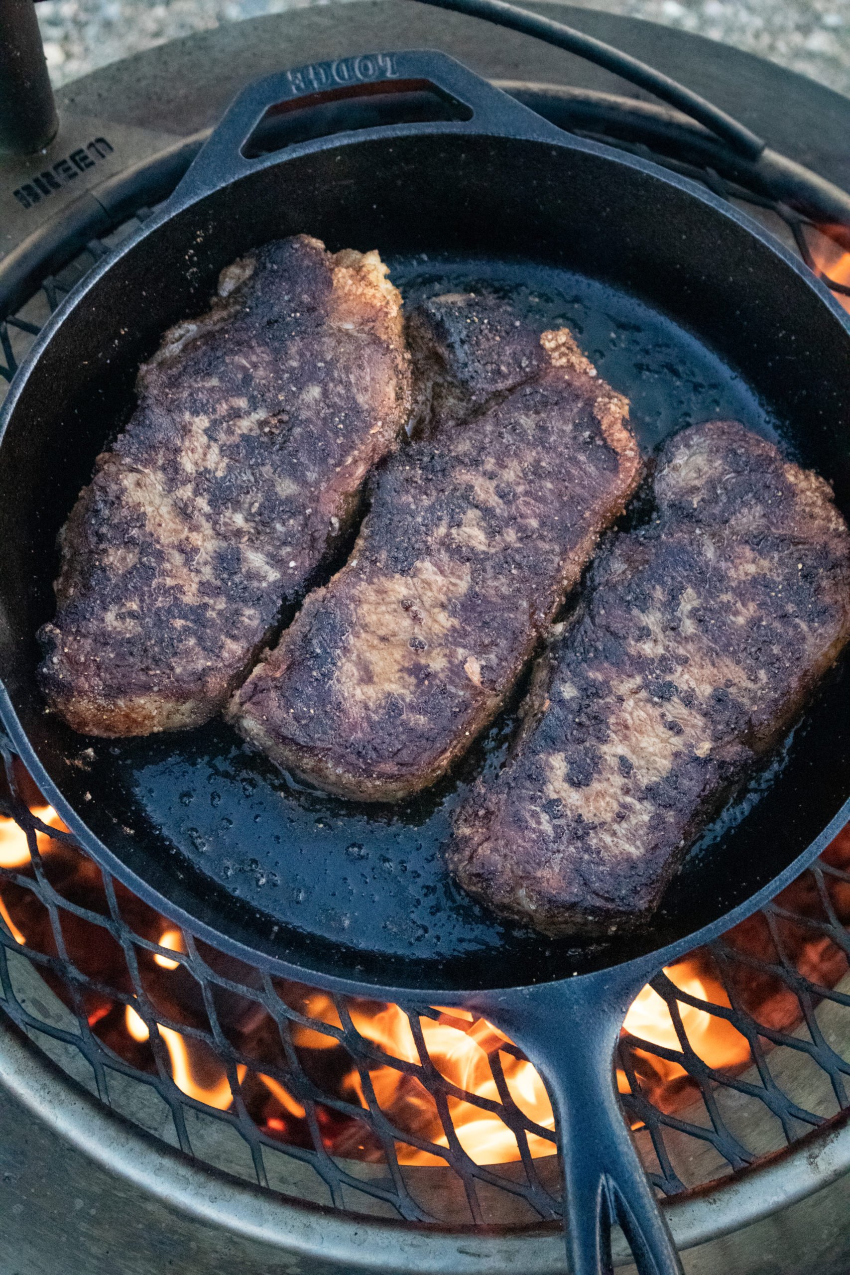 New York Strips with Bourbon Mushrooms after the first flip.