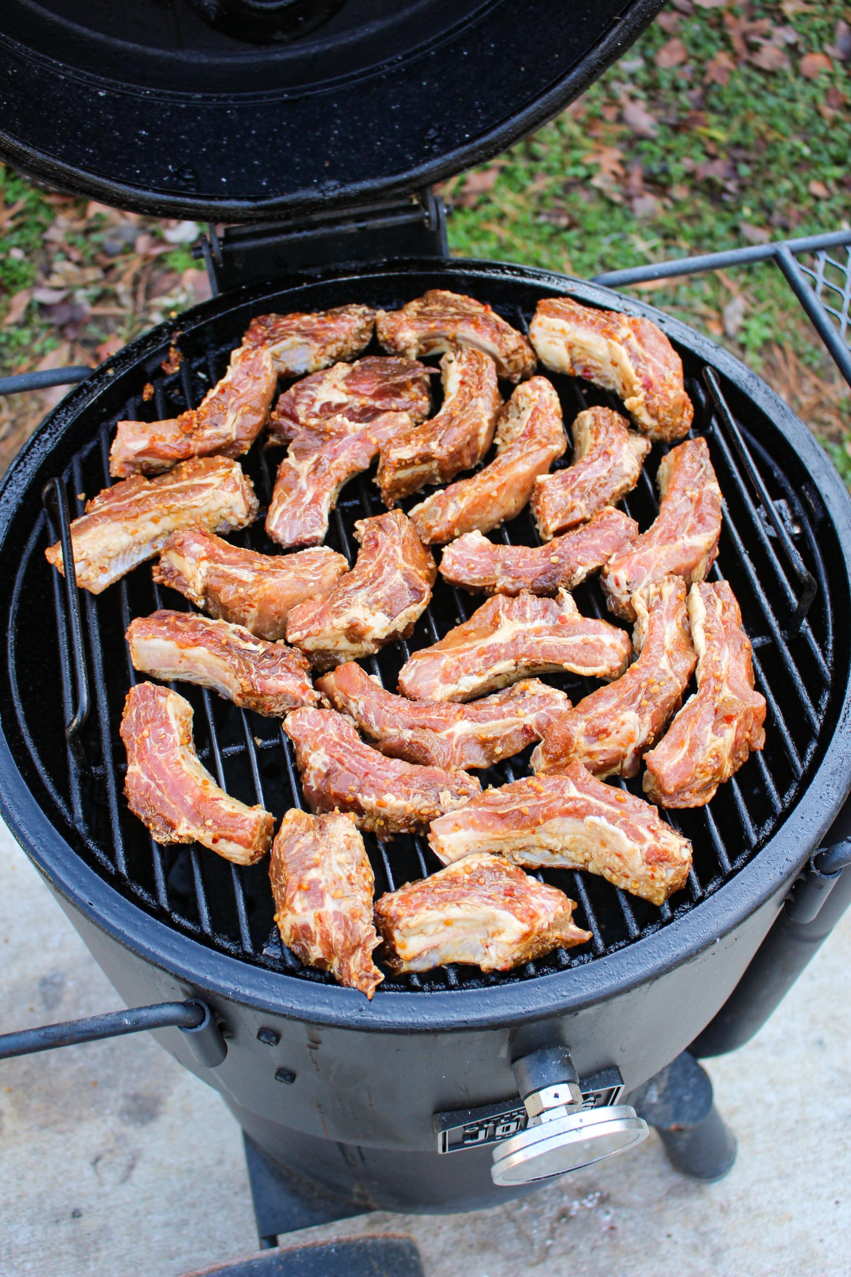 Fried Sticky Wings getting arranged on the smoker. 