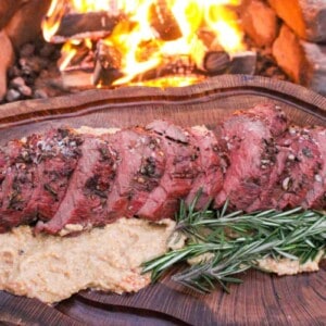 Herb Crusted Bison Tenderloin cut and fanned out to serve.