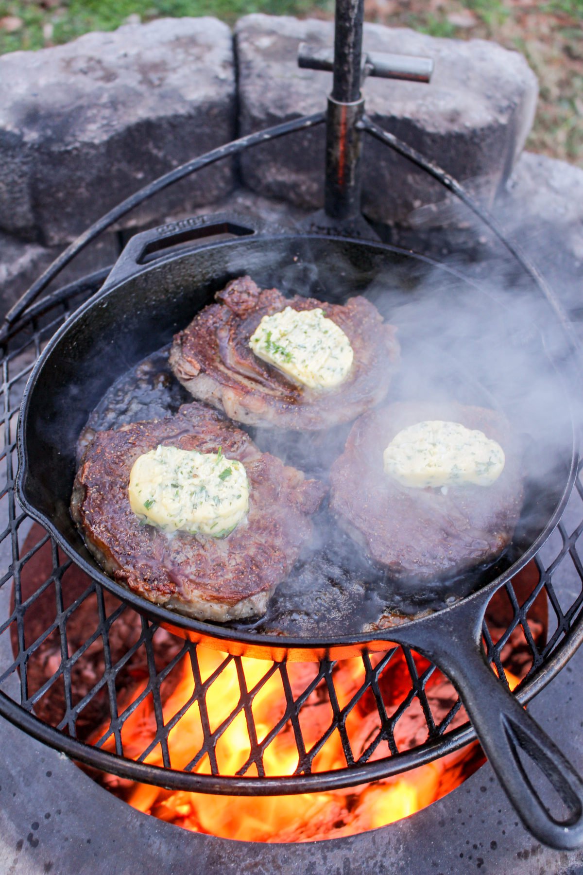 Garlic Butter Steak getting topped with the herb butter. 