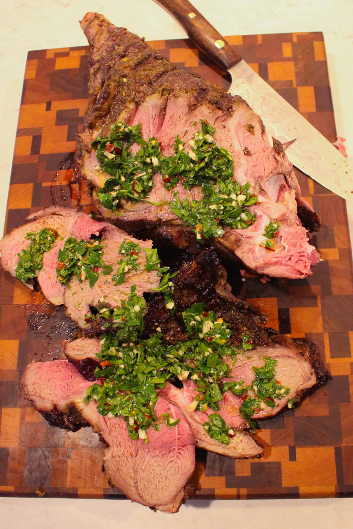 Lamb sliced and topped with the chimichurri.