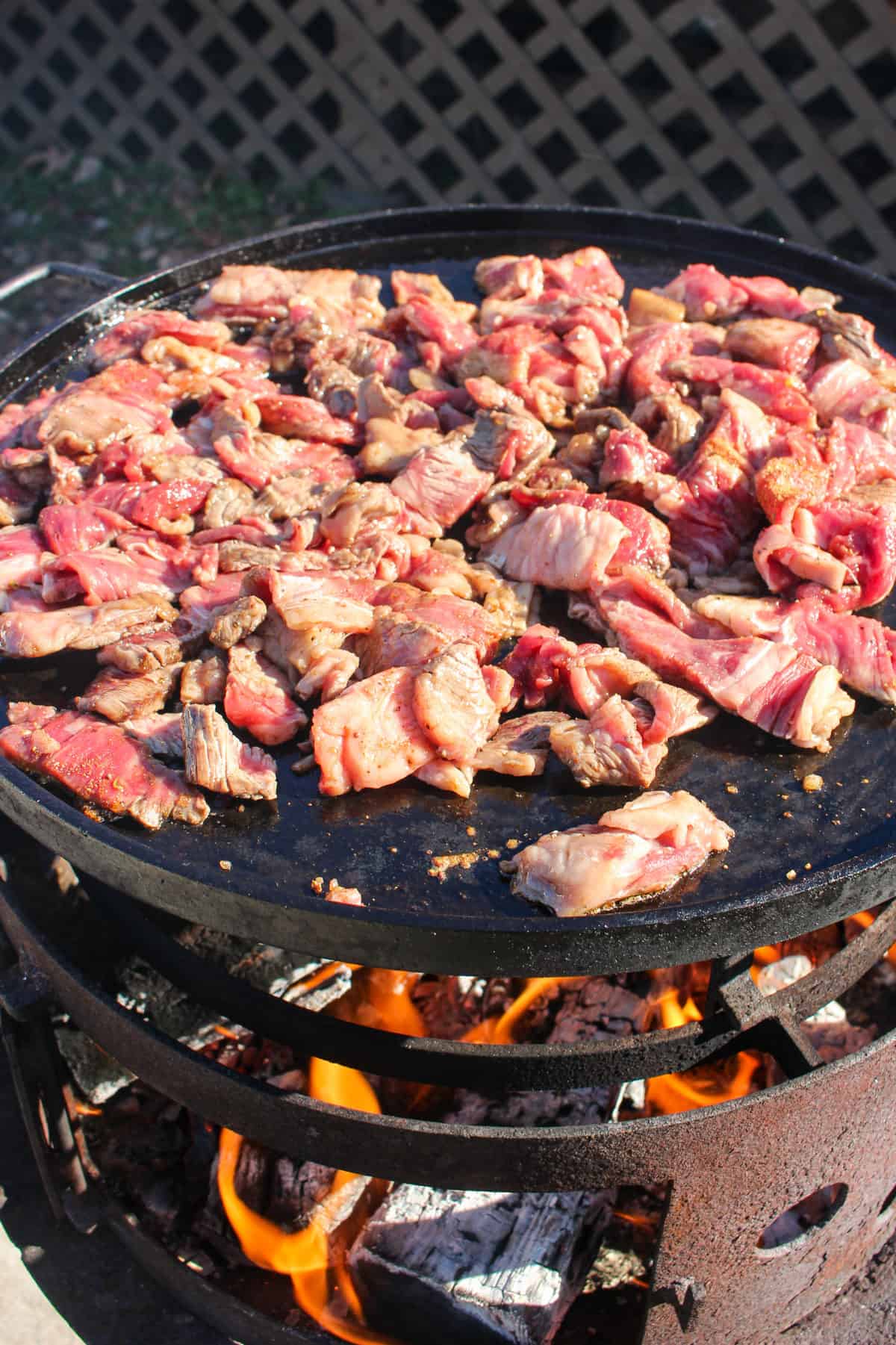 Ribeyes for the Cheesesteak Quesadillas starting to cook in the plancha.