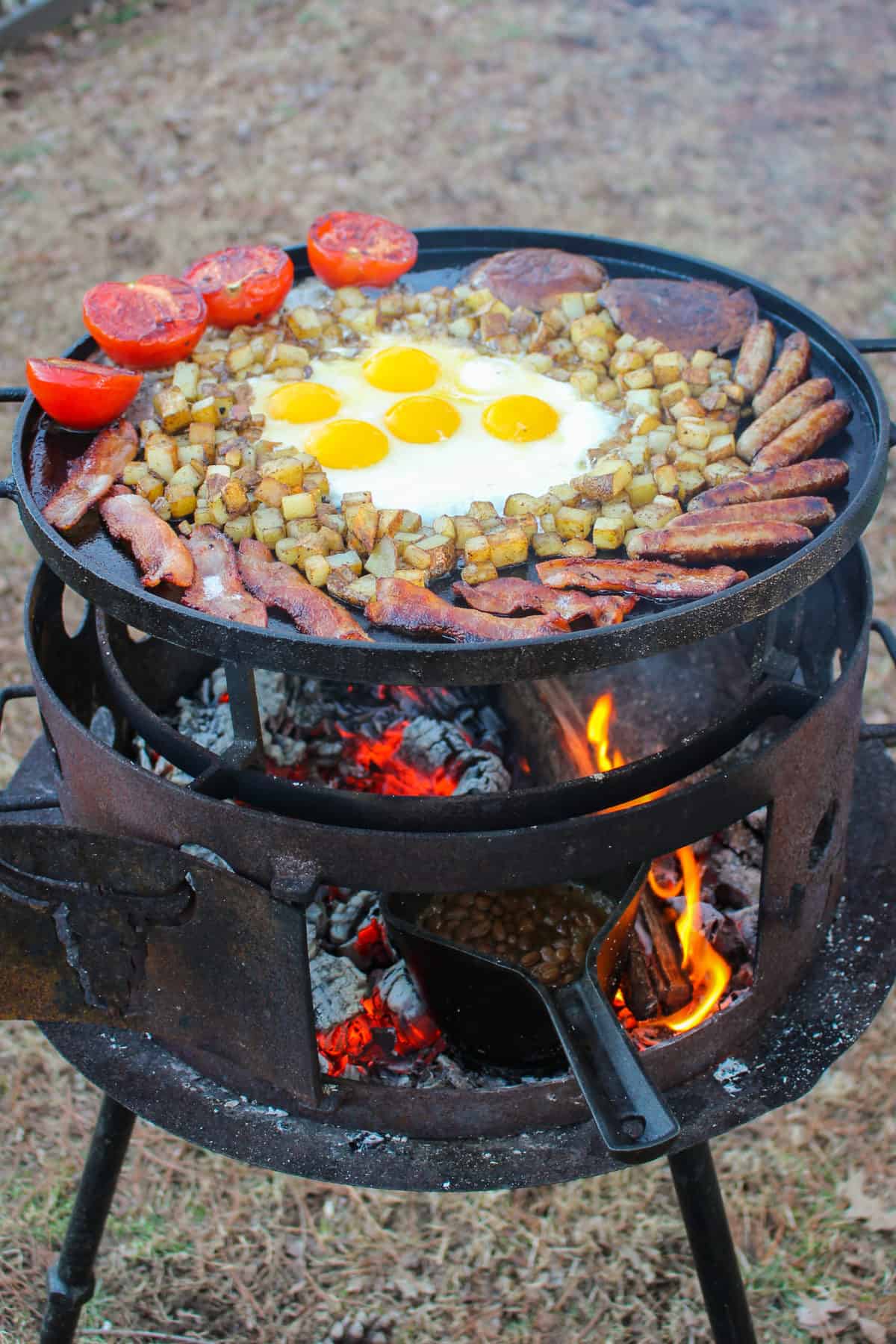 Breakfast Fry Up almost finished with the baked beans cooking next to the coals. 