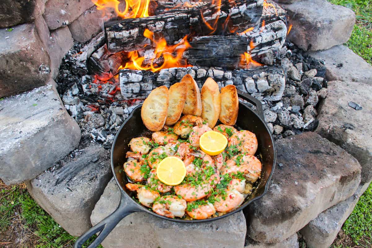 Garlic Shrimp Scampi is served in the skillet with some bread.