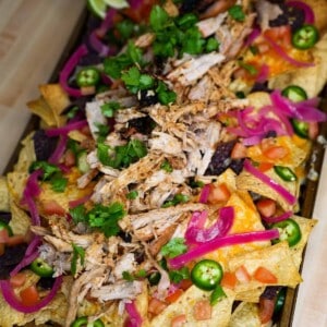 Pulled Pork Nachos with all the toppings and ready to eat!