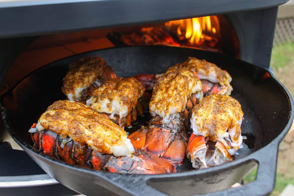 The lobster tails, covered in Chipotle Garlic Rub and set in the fire oven. 