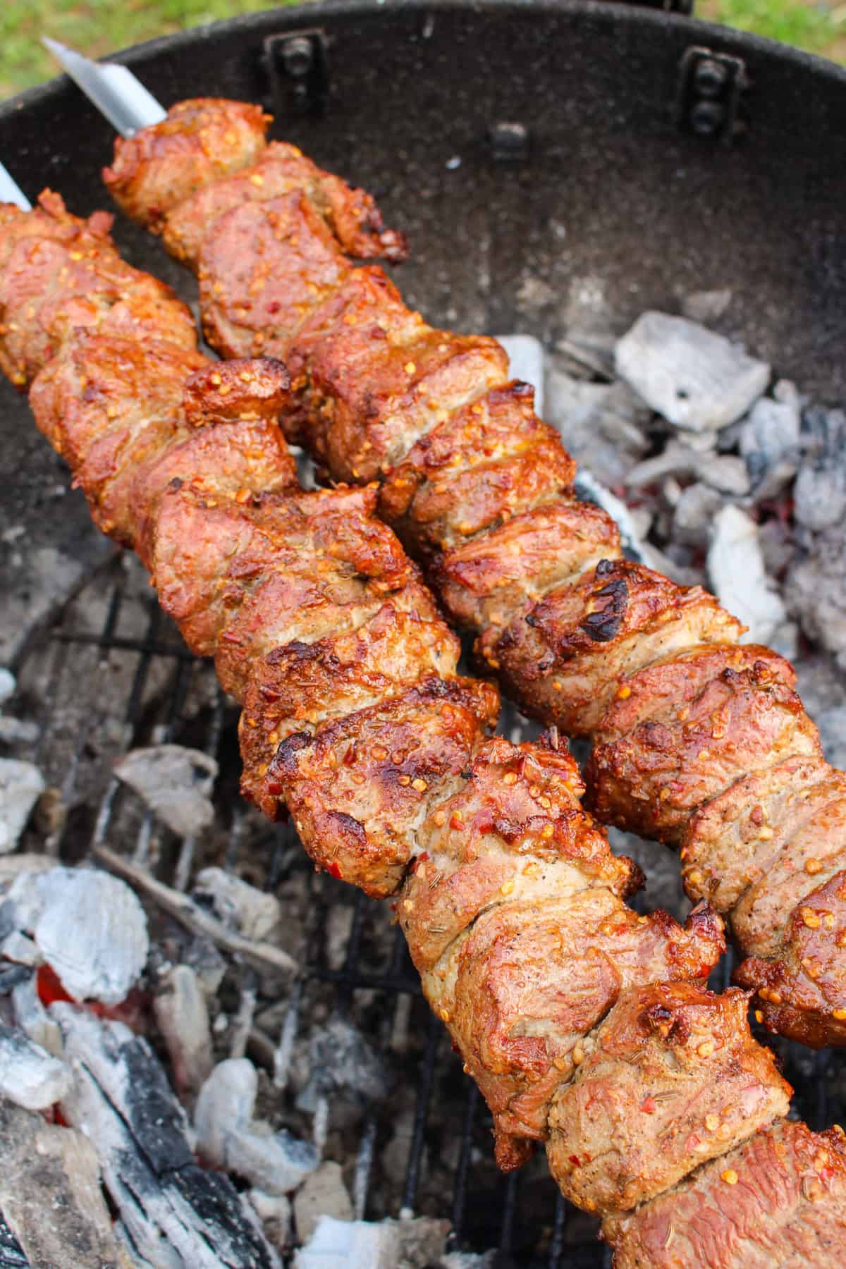 Spiced Lamb Kebabs with Mint Chimichurri cooking and started to char around the edges