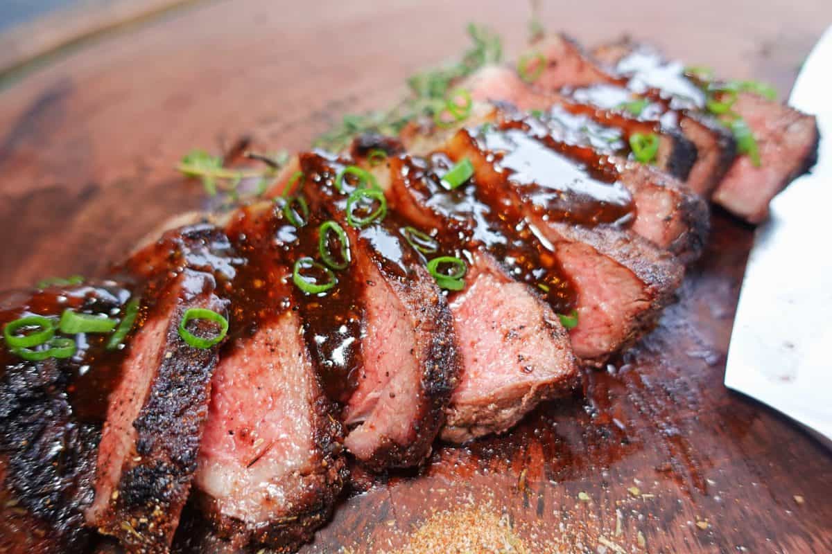 Cajun Rubbed Bourbon Street Steaks are served.