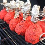 Flamin' Hot Chicken Lollipops after they've been covered in Cheetos.