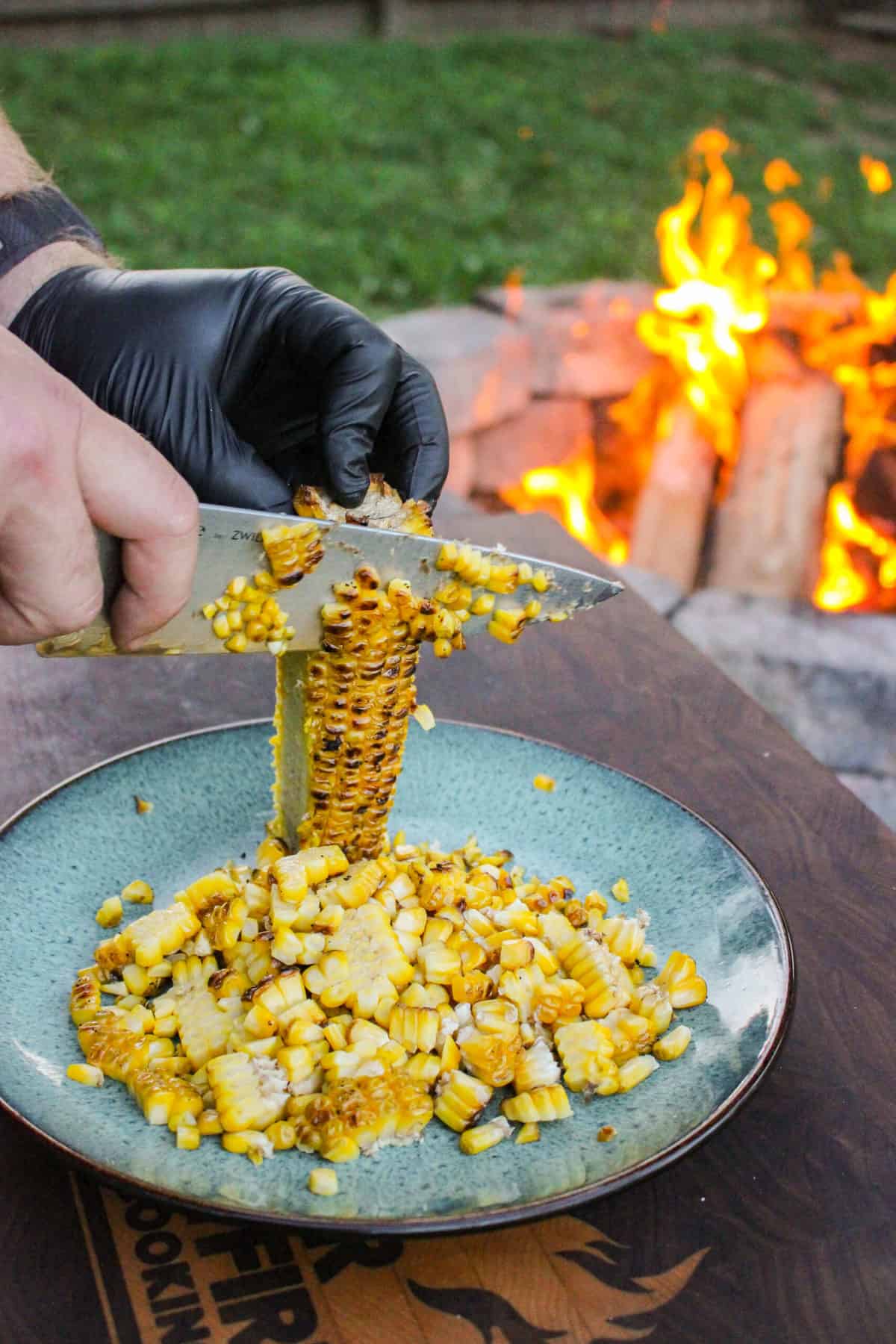 corn being sliced off of the cob