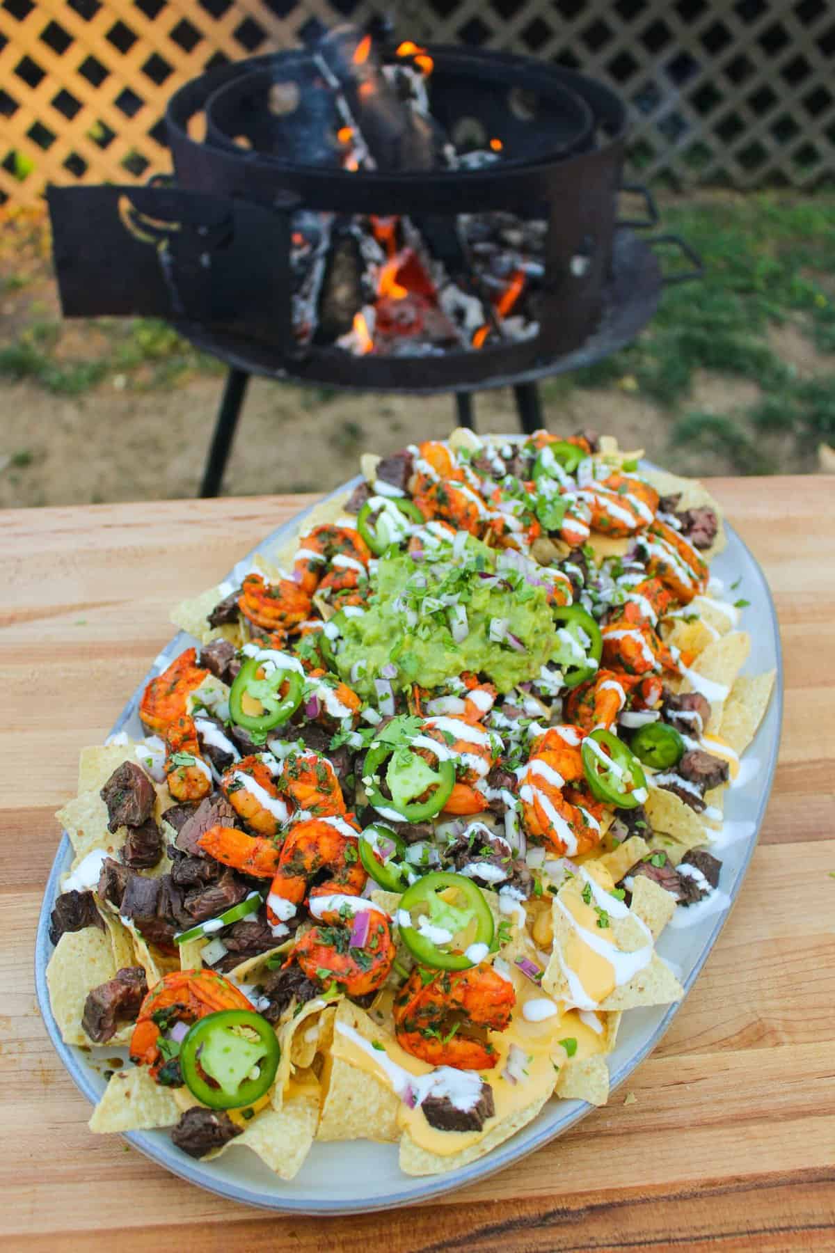 overhead of a platter filled with surf and turf nachos
