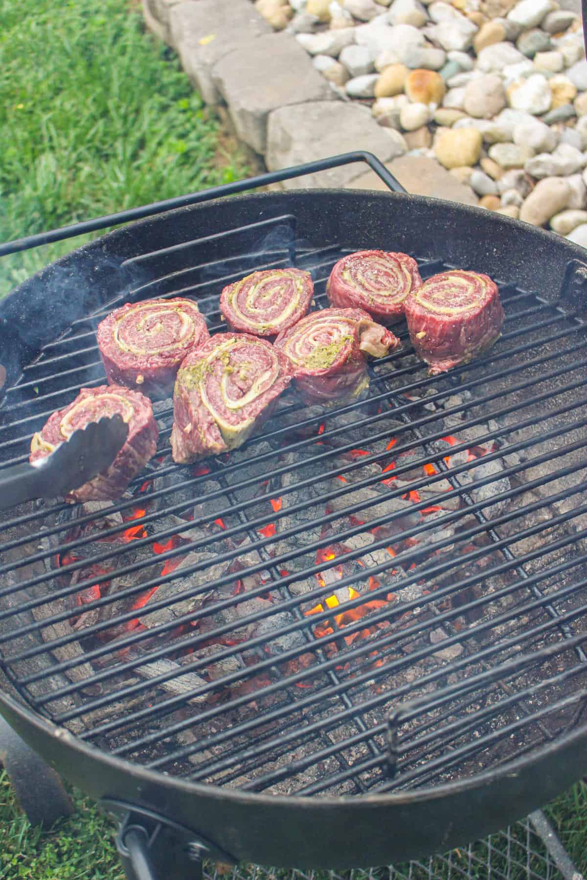 overhead of steak pinwheels on the grill
