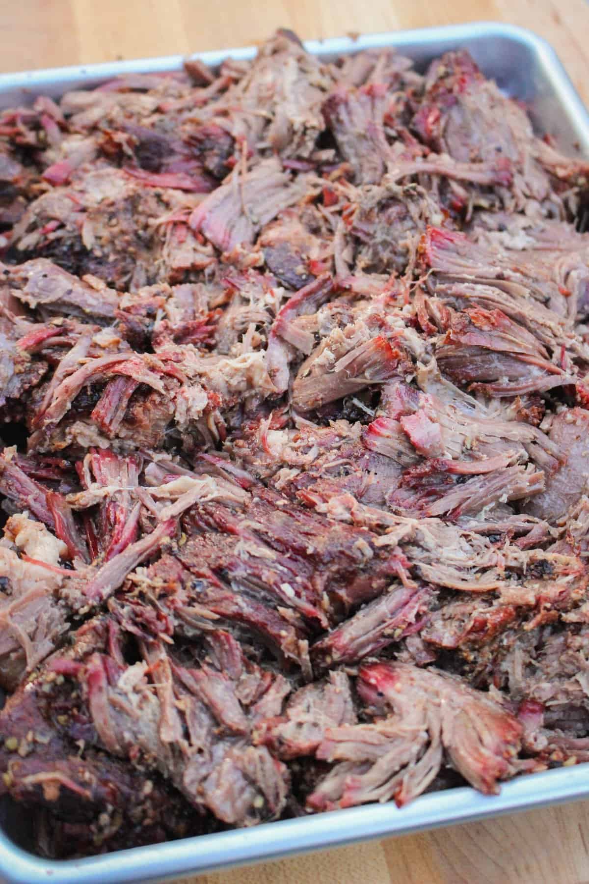 closeup of shredded beef on a baking sheet