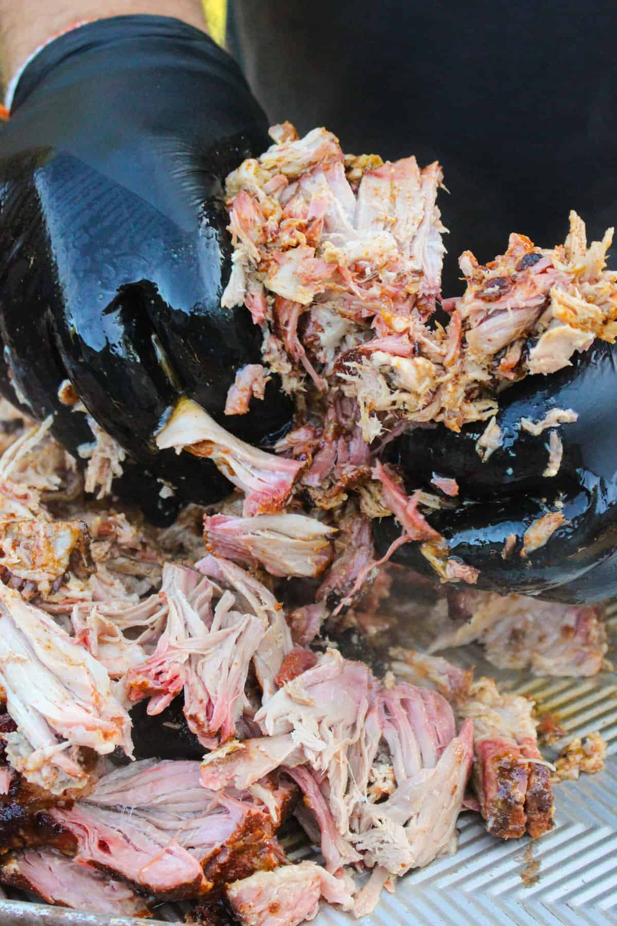 closeup of pork being shredded