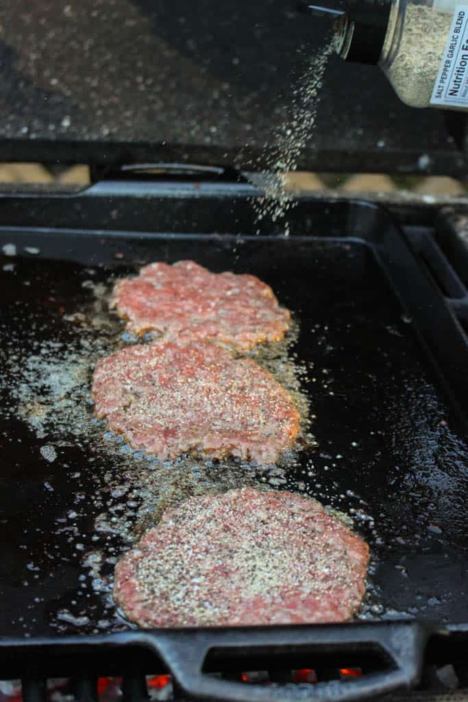 cooked burger patties on a skillet