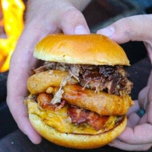 a western bbq burger held over a fire