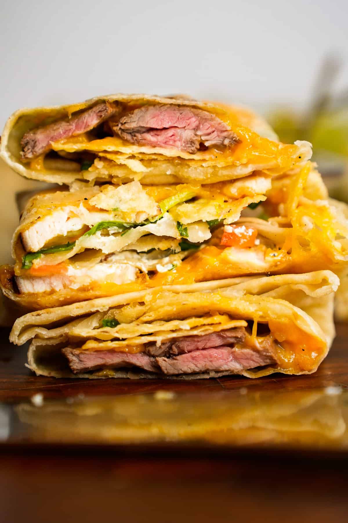 A stack of slicked crunchwrap supremes.