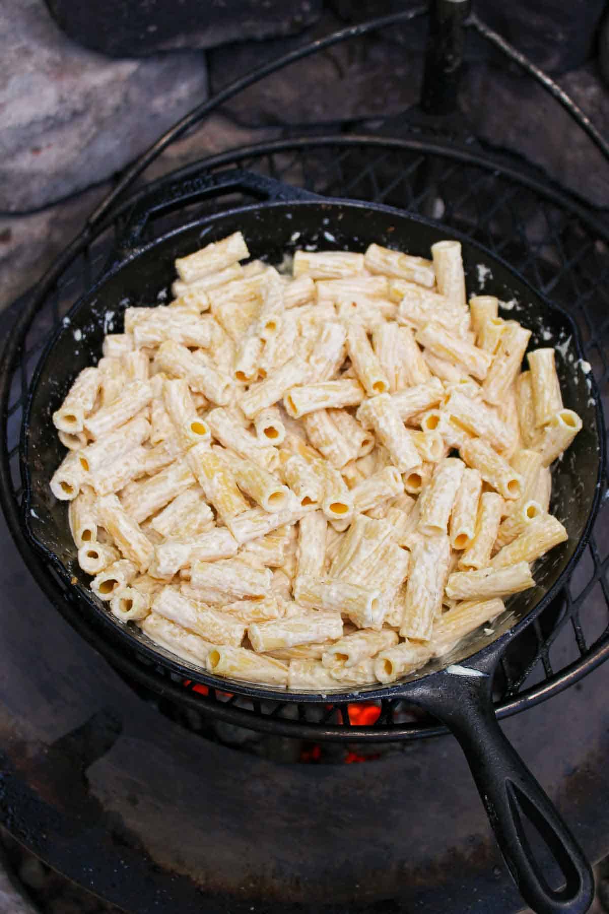 a skillet full of pasta for steak and cheesy pasta 