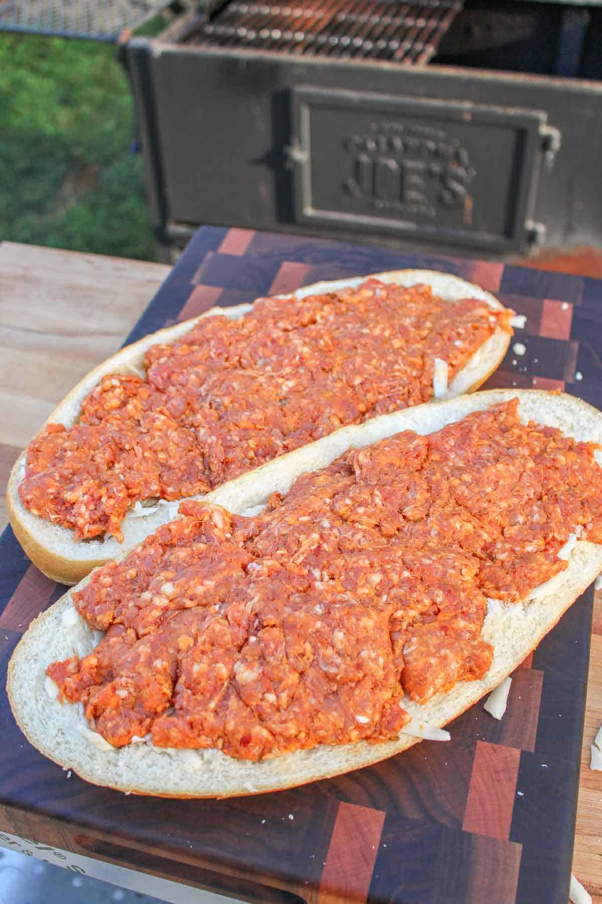 cheese stuffed bread topped with ground Italian sausage