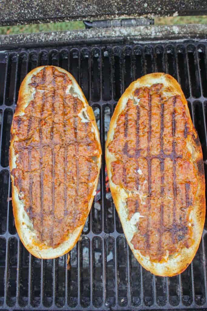 overhead of two halves of Italian bread on a grill