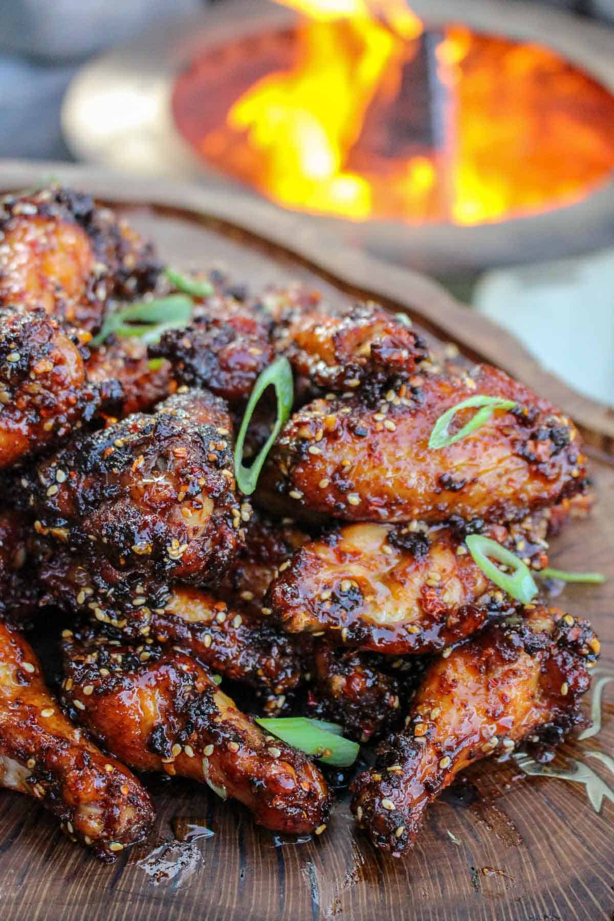 closeup of finished honey chili oil chicken wings on a platter