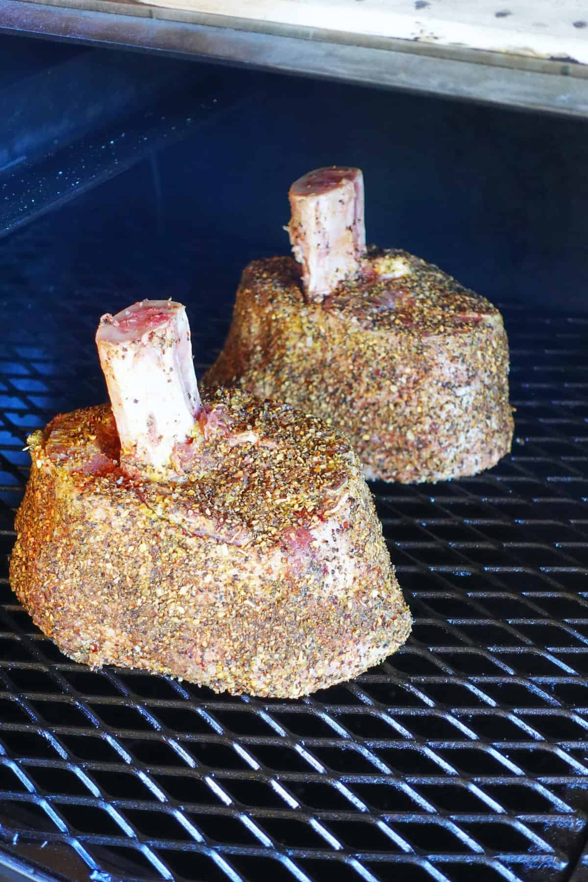 Seasoned beef shanks on the smoker.