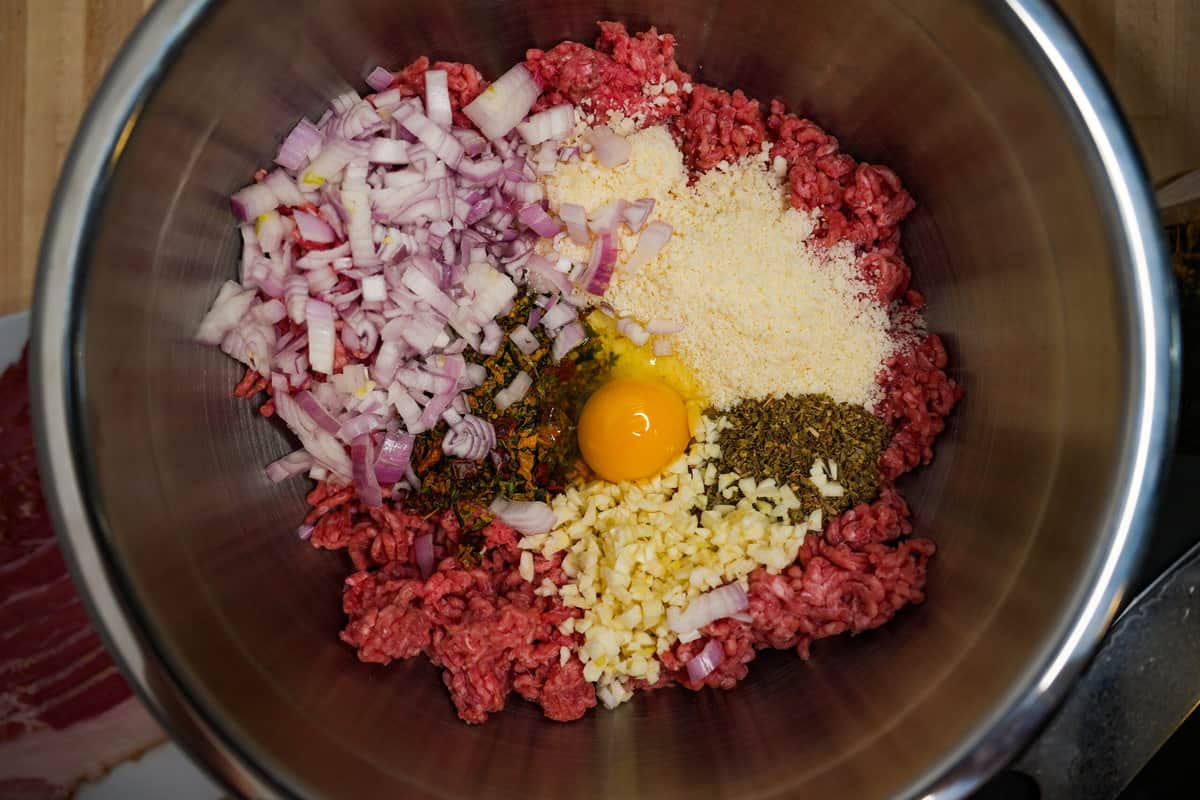 All the meatball ingredients in a bowl ready to be mixed. 