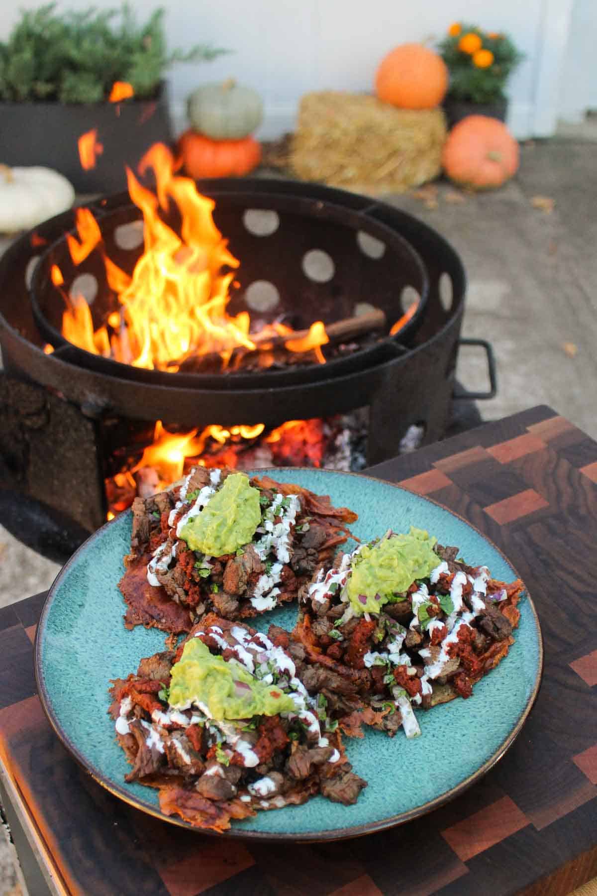A plated shot of three Grilled Steak Vampiro Tacos.
